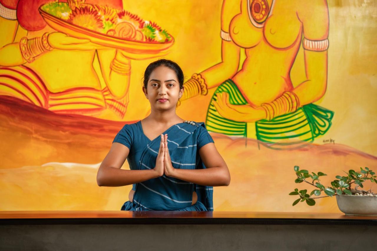 Atha Resort Sigiriya Bagian luar foto A woman greeting with Namaste